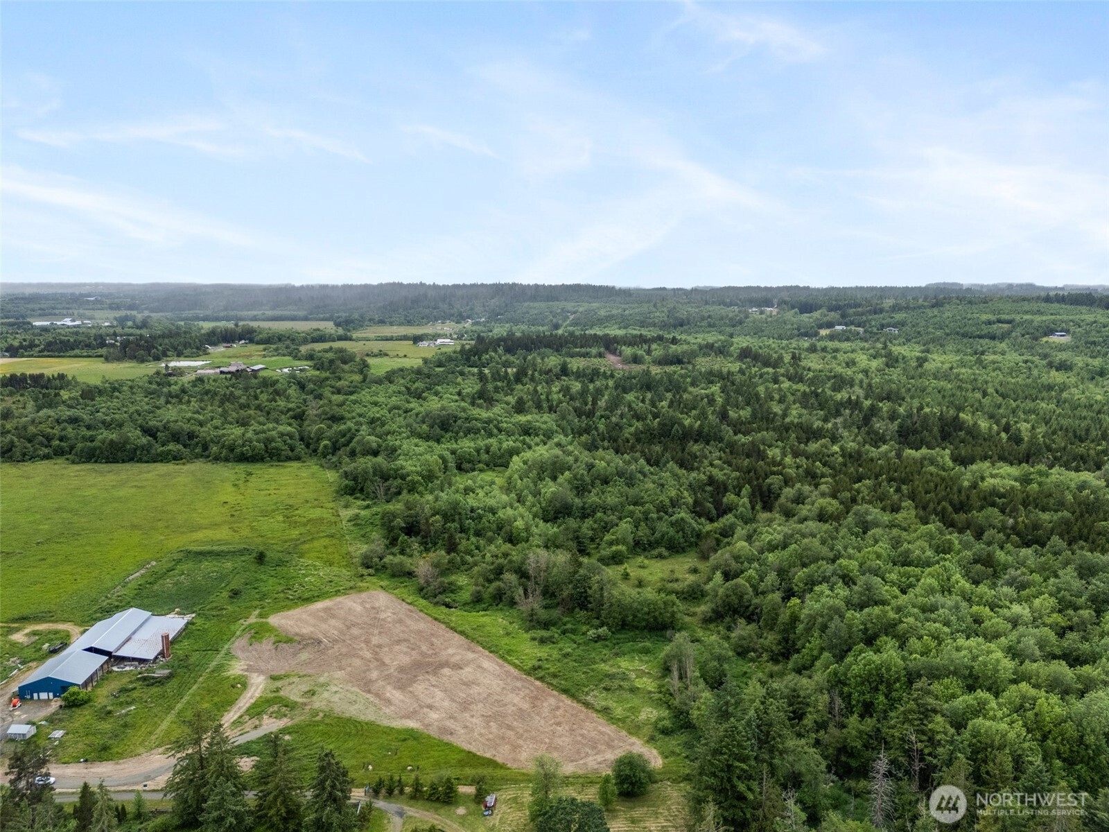 233 Allison Road Ethel, WA 98542 - Photo 12 of 20 a view of a city with lush green forest
