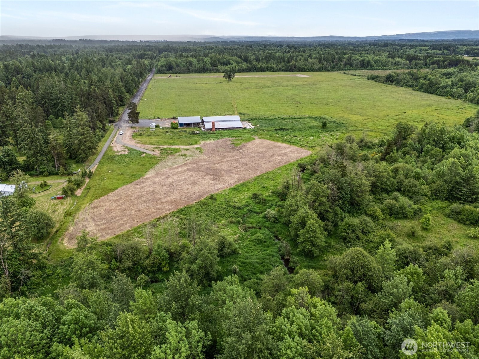 233 Allison Road Ethel, WA 98542 - Photo 16 of 20 a view of a field with an ocean