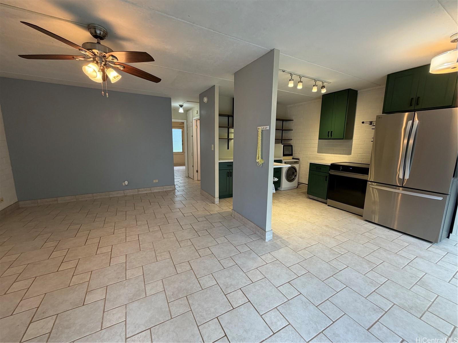 45-535 Luluku Road, Unit G1 Kaneohe, HI 96744 - Photo 1 of 15 a view of a kitchen with a sink and refrigerator