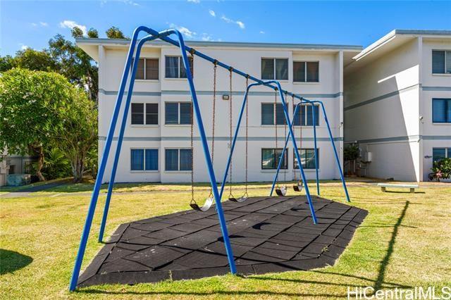 45-535 Luluku Road, Unit G1 Kaneohe, HI 96744 - Photo 14 of 15 a view of a swimming pool with an outdoor seating