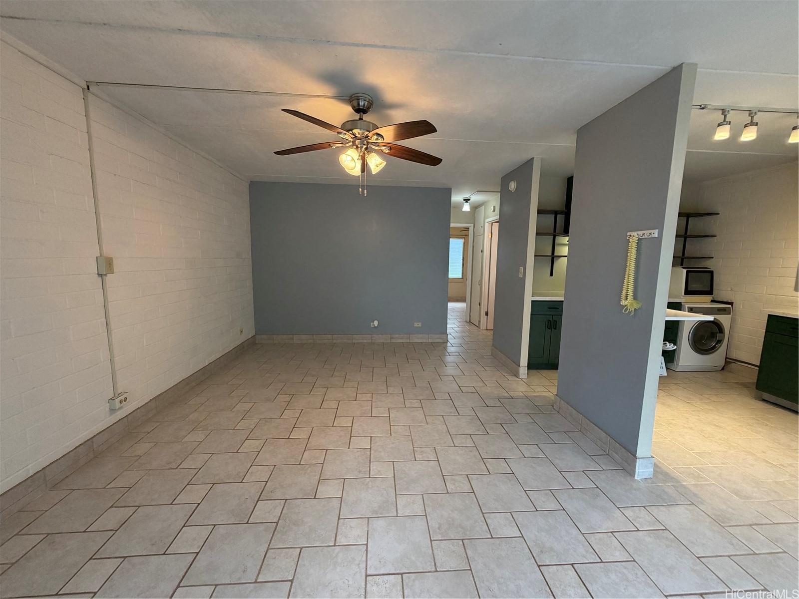45-535 Luluku Road, Unit G1 Kaneohe, HI 96744 - Photo 3 of 15 a view of an empty room with a chandelier fan