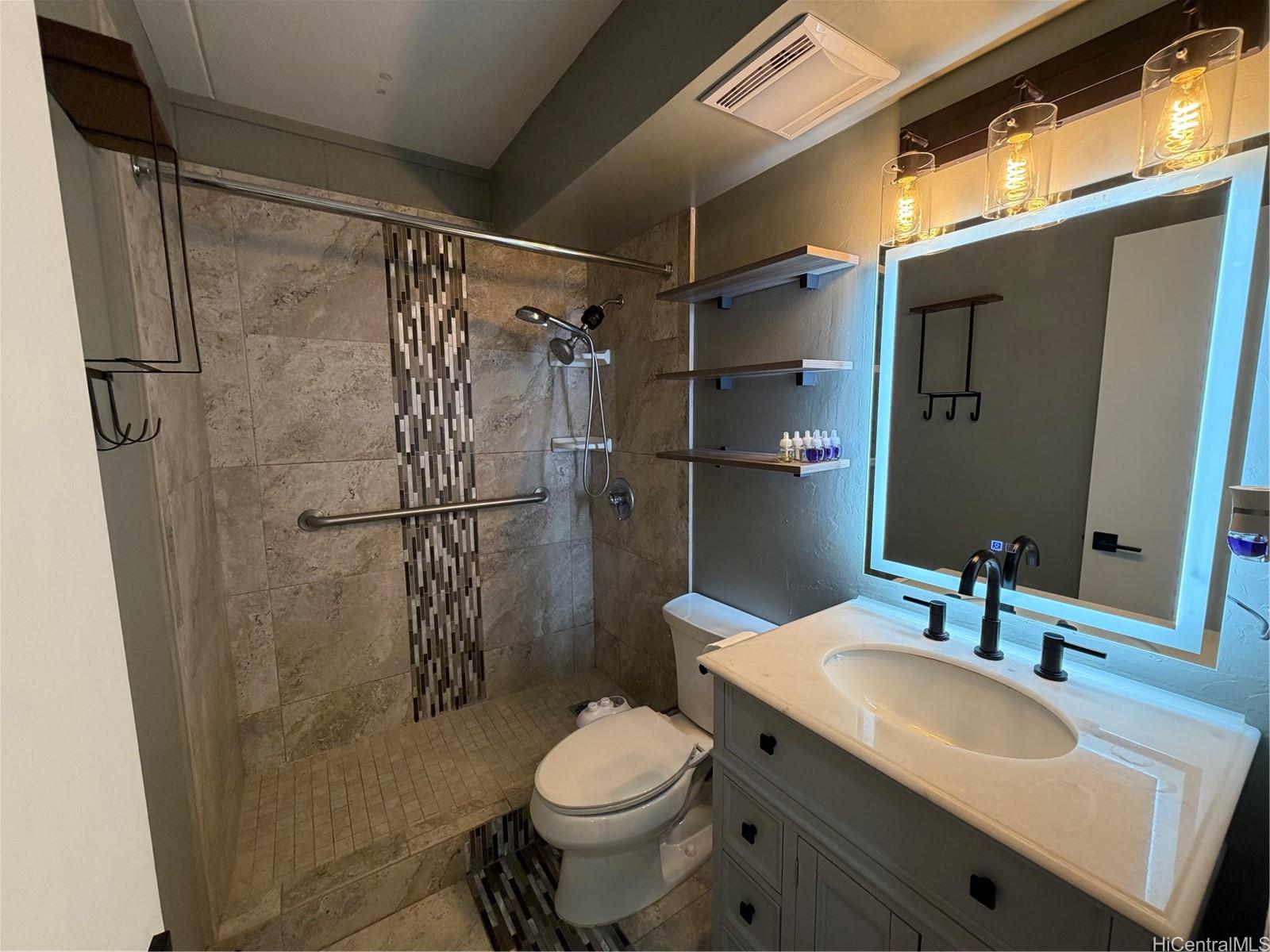 45-535 Luluku Road, Unit G1 Kaneohe, HI 96744 - Photo 7 of 15 a bathroom with a sink toilet and shower