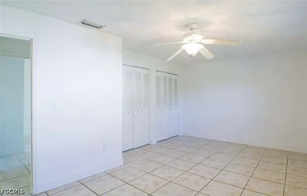 a view of a chandelier fan in a room