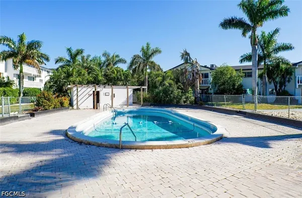 a view of a swimming pool with a patio