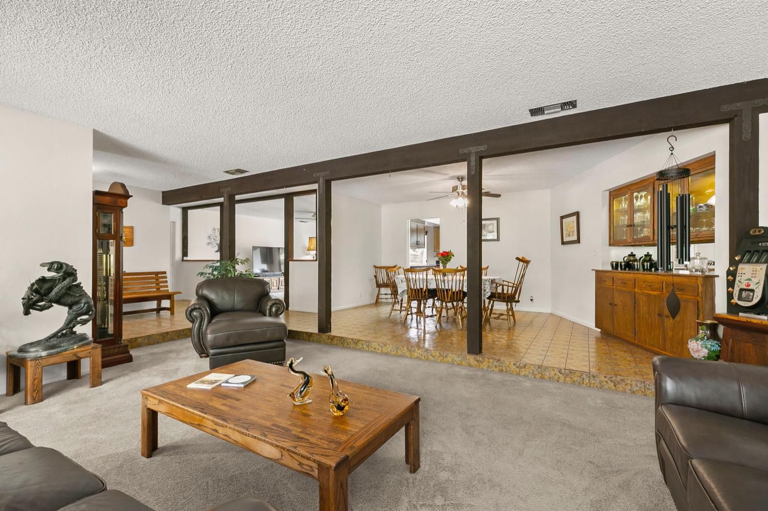 218 Sierra Road Ojai, CA 93023 - Photo 12 of 50 a living room with furniture a rug and a floor to ceiling window
