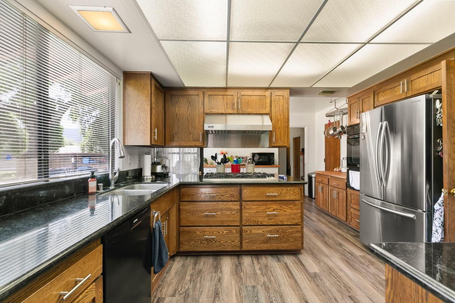 218 Sierra Road Ojai, CA 93023 - Photo 19 of 50 a kitchen with stainless steel appliances a refrigerator and a sink