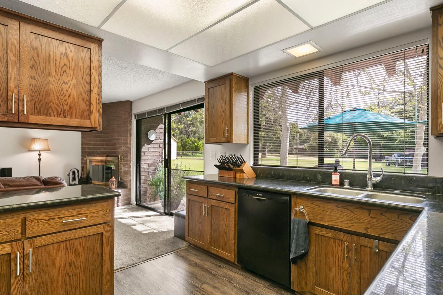 218 Sierra Road Ojai, CA 93023 - Photo 21 of 50 a kitchen with stainless steel appliances granite countertop sink stove and large window