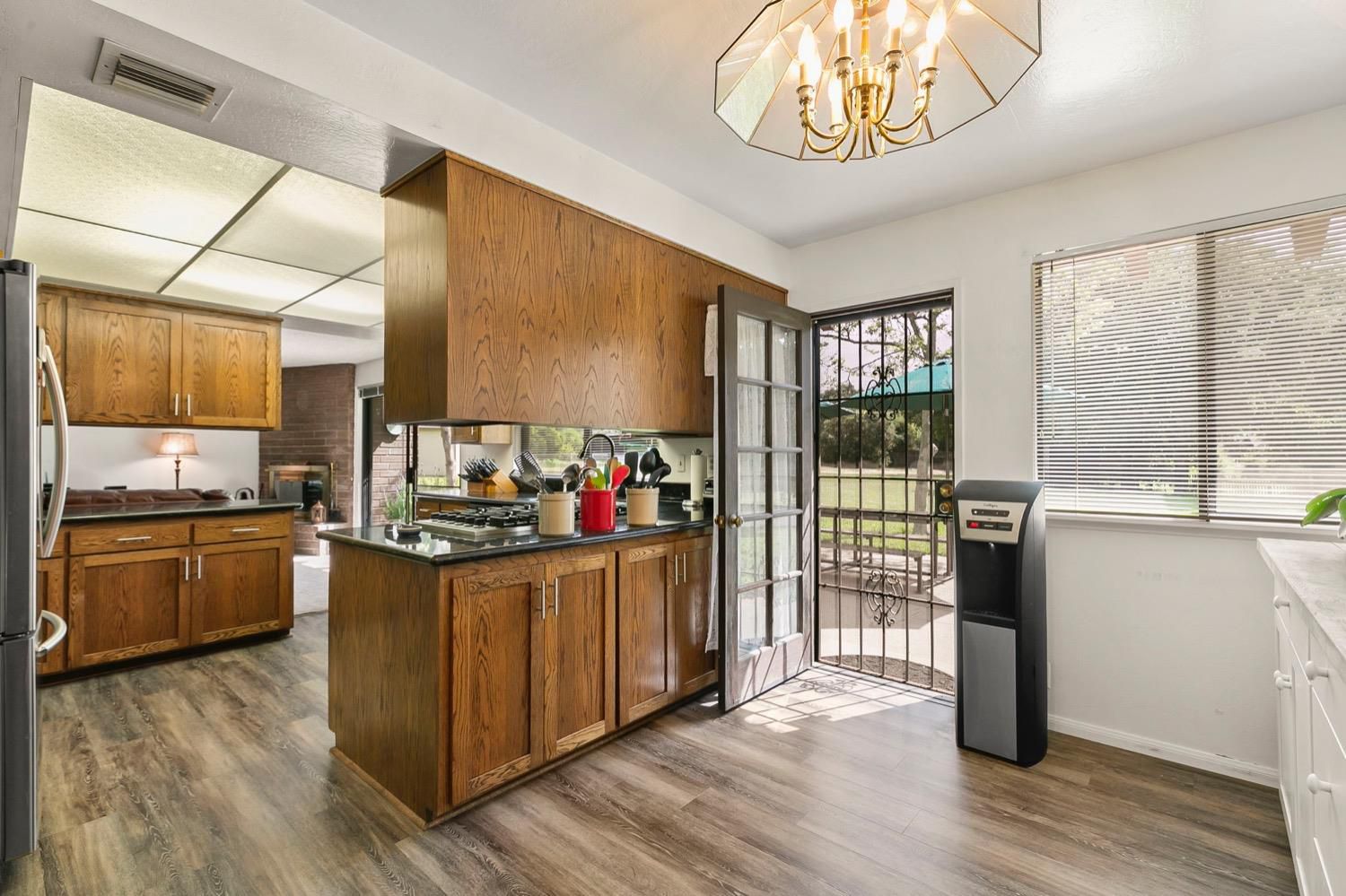 218 Sierra Road Ojai, CA 93023 - Photo 22 of 50 a kitchen with stove and wooden floor