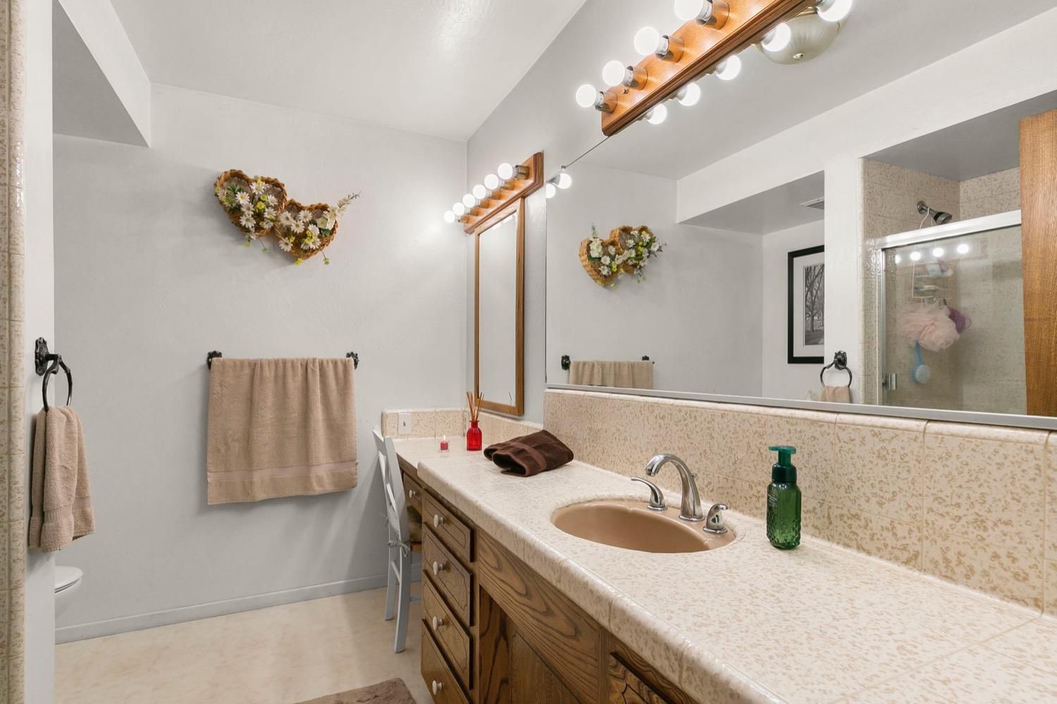 218 Sierra Road Ojai, CA 93023 - Photo 31 of 50 a bathroom with a sink and a mirror