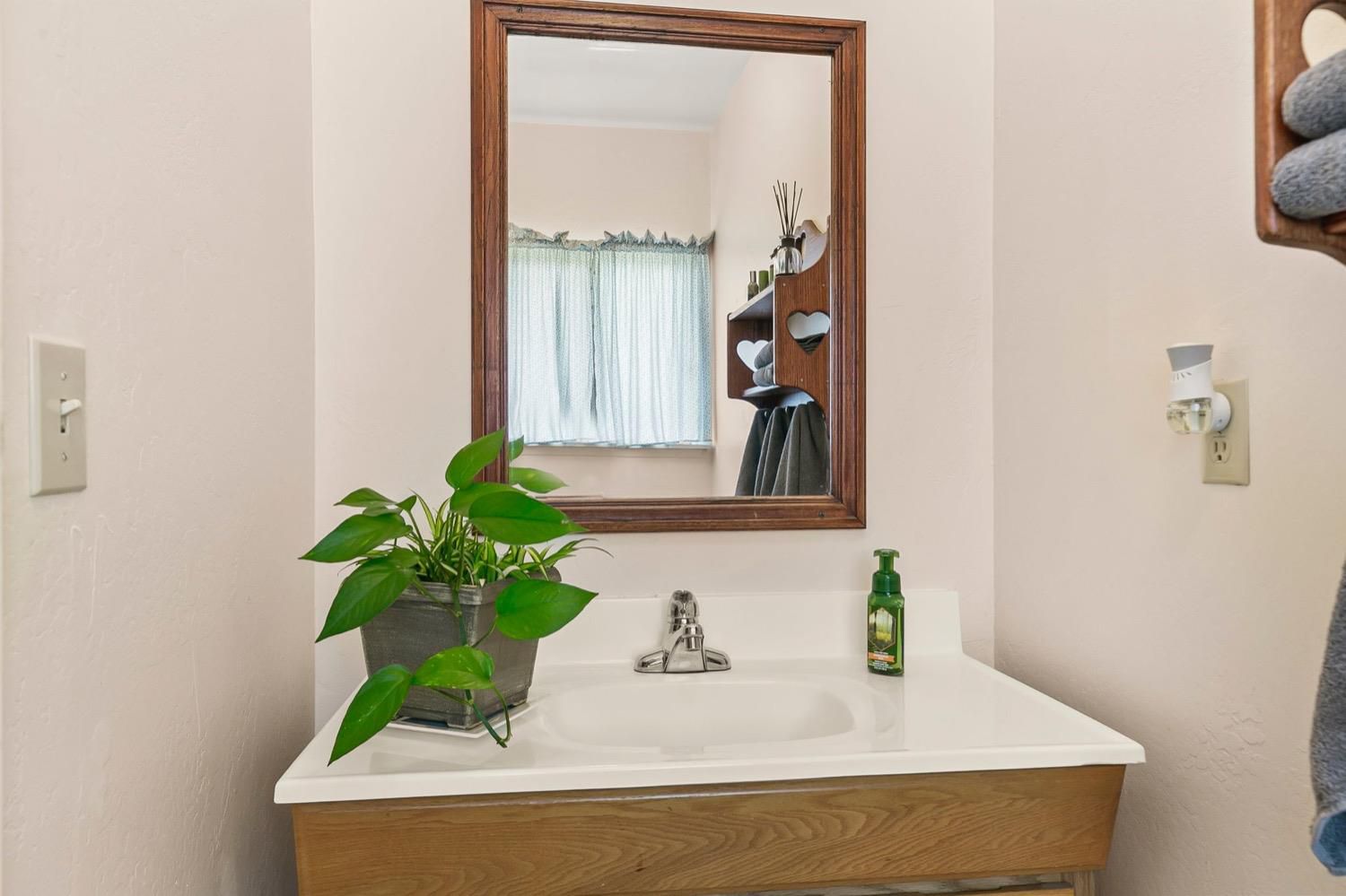 218 Sierra Road Ojai, CA 93023 - Photo 33 of 50 a bathroom with a sink and a mirror