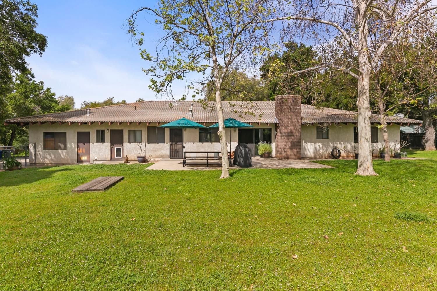 218 Sierra Road Ojai, CA 93023 - Photo 37 of 50 a front view of a house with a yard table and chairs