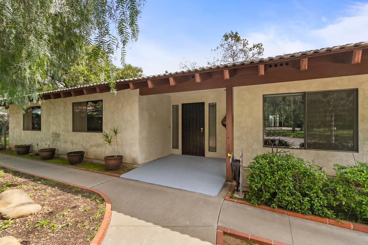 218 Sierra Road Ojai, CA 93023 - Photo 6 of 50 a front view of a house with a garden