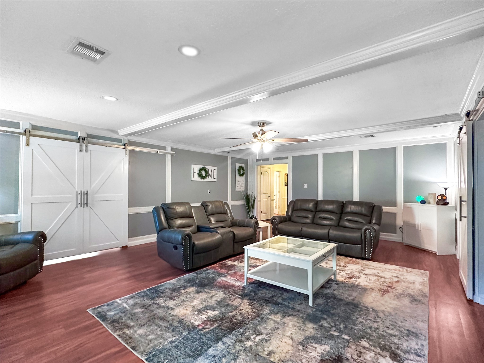 6511 Castle Pine Lane Spring, TX 77379 - Photo 20 of 49 Inviting living room filled with warmth and natural light, offering an open layout ideal for entertaining guests or relaxing with family.