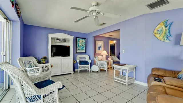a bedroom with a bed table and a window