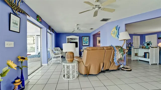 a view of a house with swimming pool and sitting area