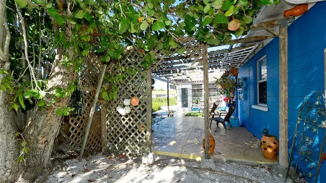 an aerial view of a house with outdoor space and lake view