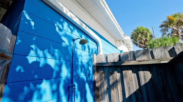 an aerial view of a house with a yard basket ball court and outdoor seating