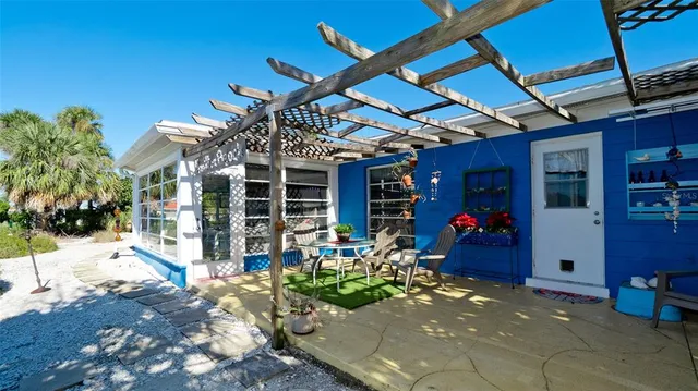 an aerial view of a house with outdoor space and a lake view