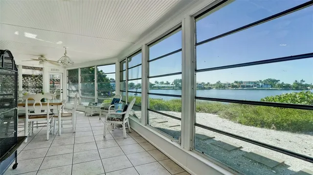 a view of balcony with wooden floor and lake view