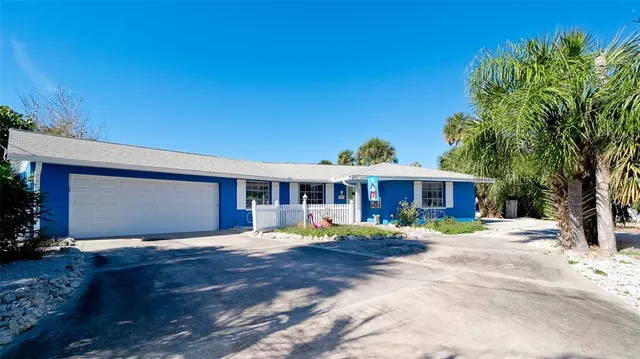 an aerial view of a house with a swimming pool