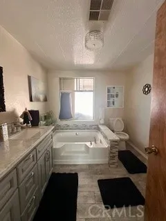 a kitchen with a sink appliances and cabinets