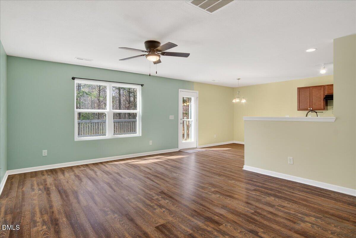 399 West Waycliff Road Henderson, NC 27537 - Photo 17 of 69 a view of an empty room with wooden floor and a window