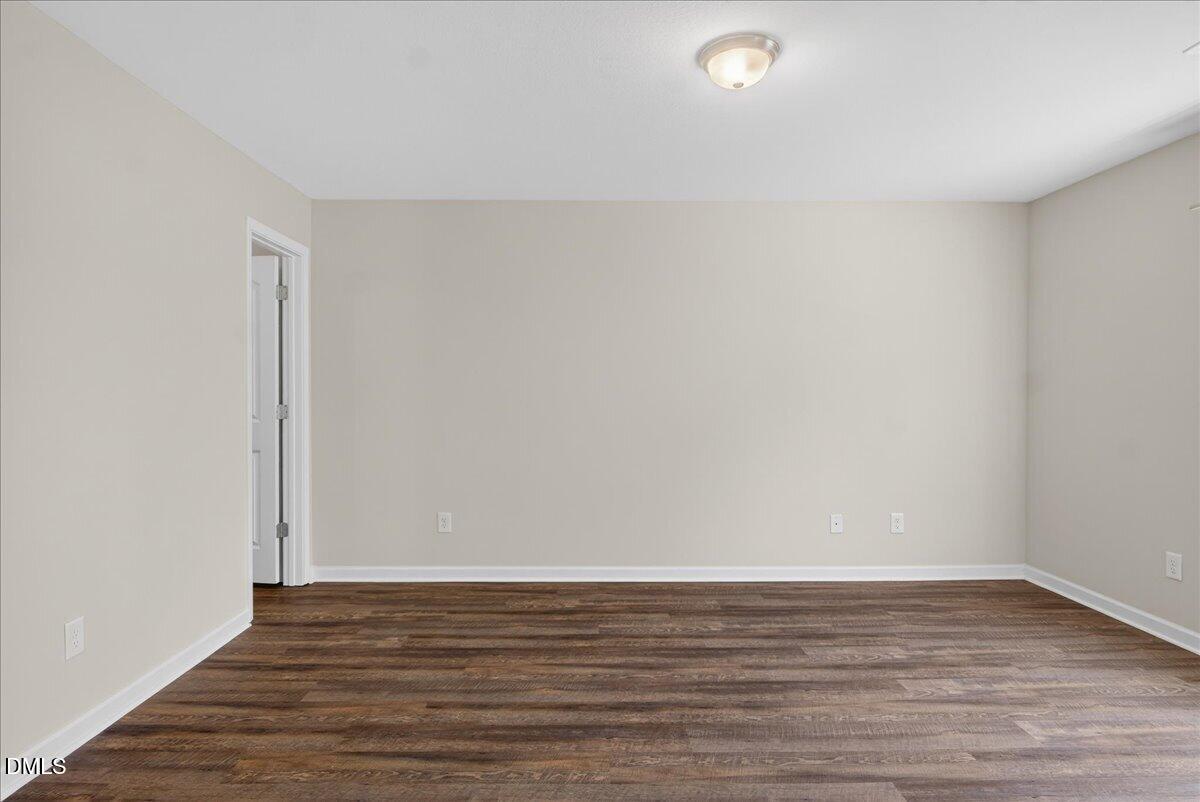 399 West Waycliff Road Henderson, NC 27537 - Photo 18 of 69 a view of an empty room and wooden floor
