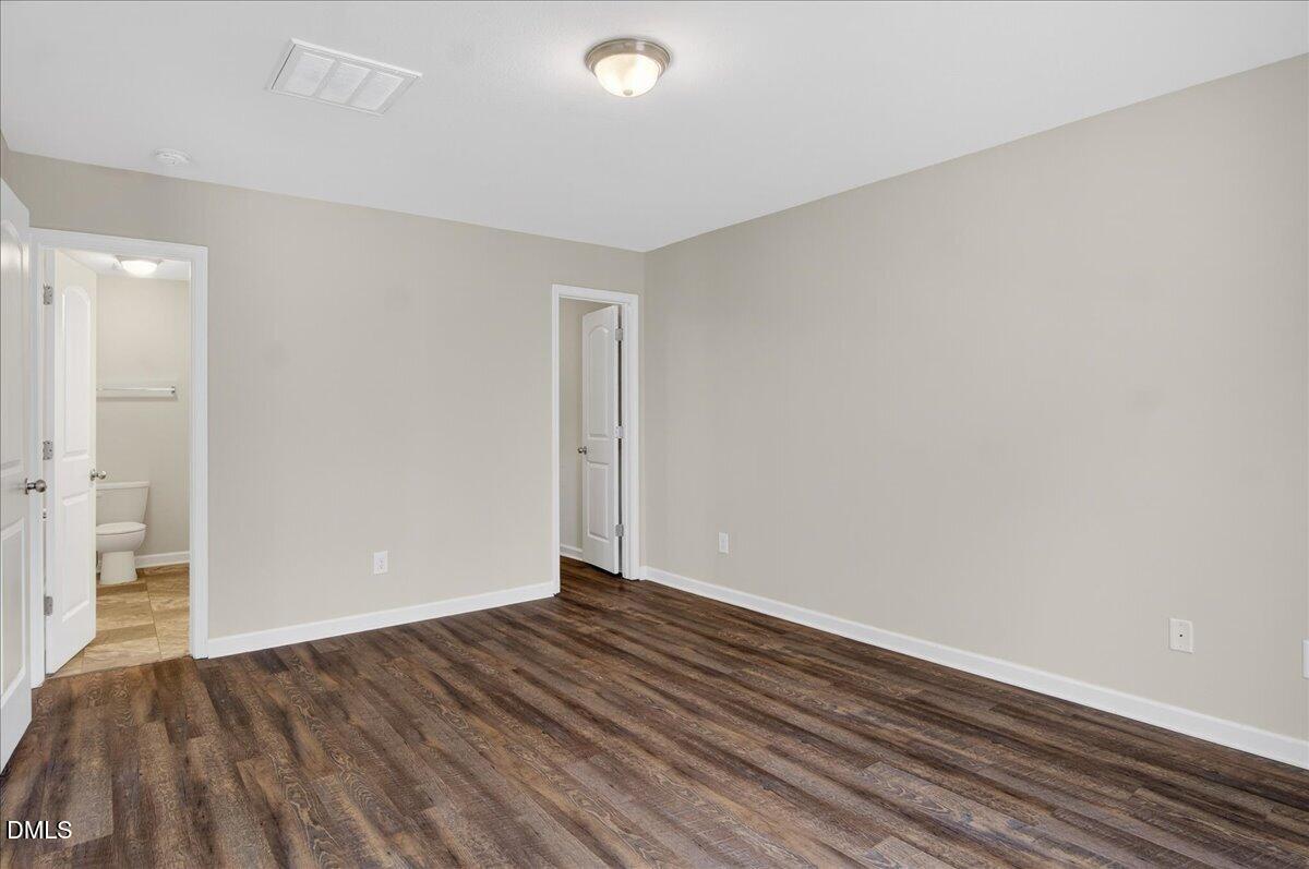 399 West Waycliff Road Henderson, NC 27537 - Photo 21 of 69 a view of room with wooden floor