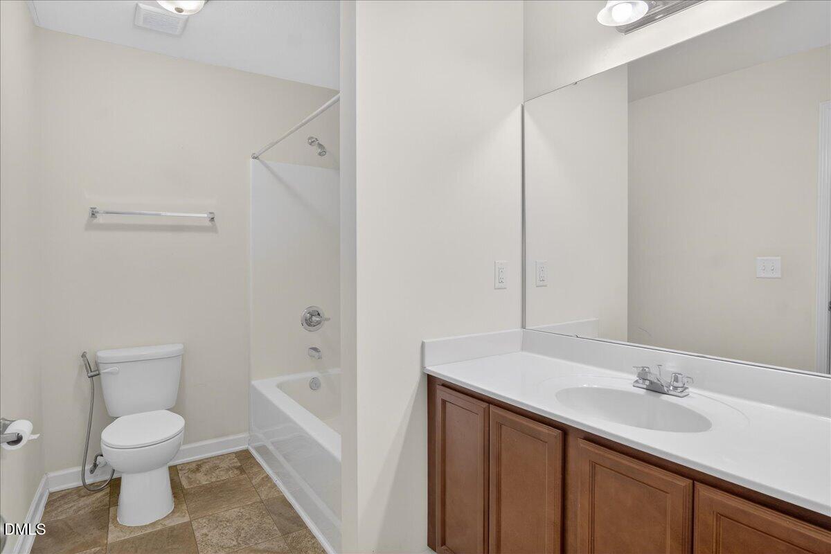 399 West Waycliff Road Henderson, NC 27537 - Photo 23 of 69 a bathroom with a sink a toilet and shower