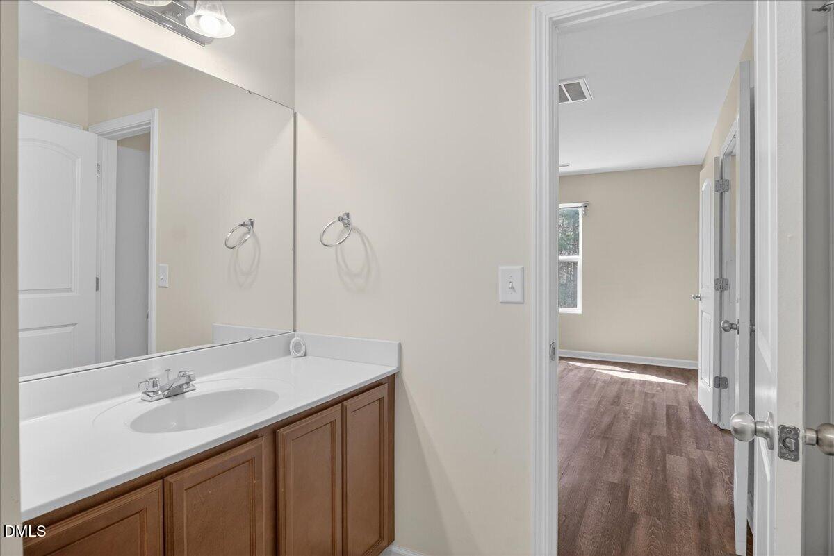 399 West Waycliff Road Henderson, NC 27537 - Photo 24 of 69 a bathroom with a sink and a mirror