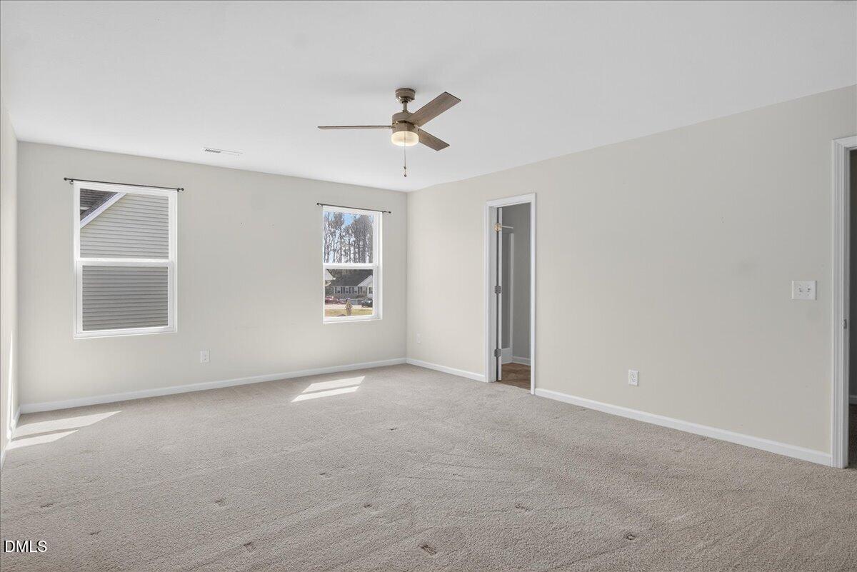 399 West Waycliff Road Henderson, NC 27537 - Photo 26 of 69 an empty room with windows and fan