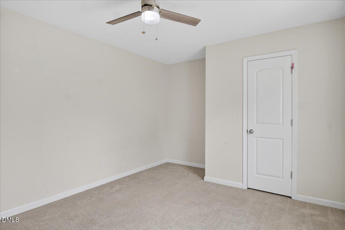 399 West Waycliff Road Henderson, NC 27537 - Photo 36 of 69 an empty room with chandelier fan