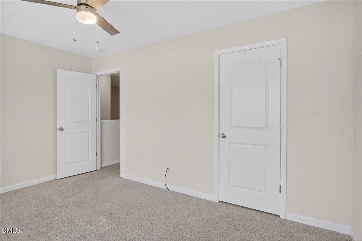 399 West Waycliff Road Henderson, NC 27537 - Photo 48 of 69 an empty room with a ceiling fan