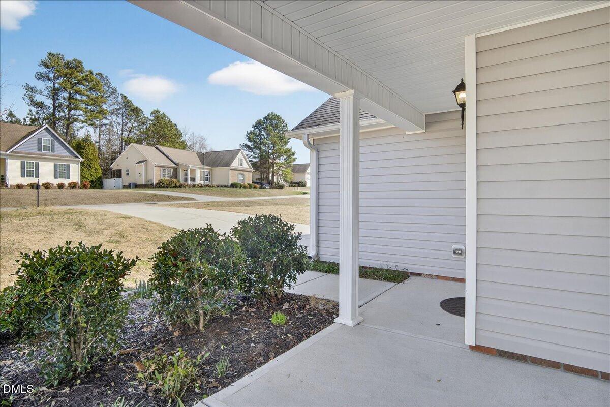 399 West Waycliff Road Henderson, NC 27537 - Photo 65 of 69 a view of a house with a yard and garage