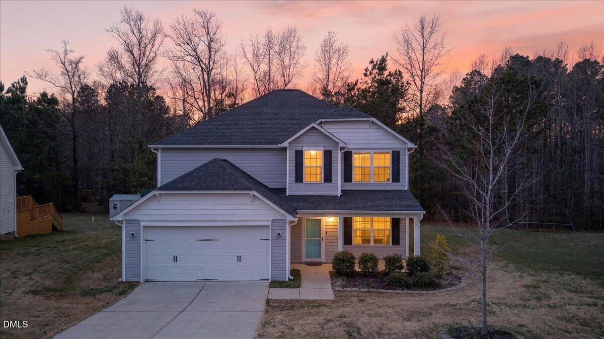 399 West Waycliff Road Henderson, NC 27537 - Photo 66 of 69 a front view of a house with a yard and trees