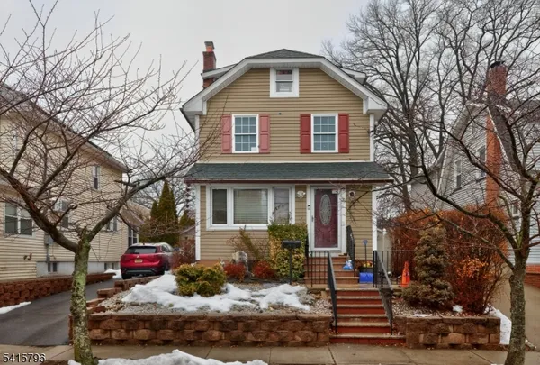 a front view of a house with yard
