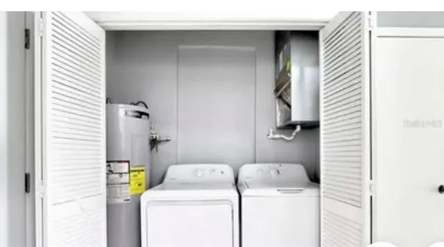 a utility room with dryer and washer