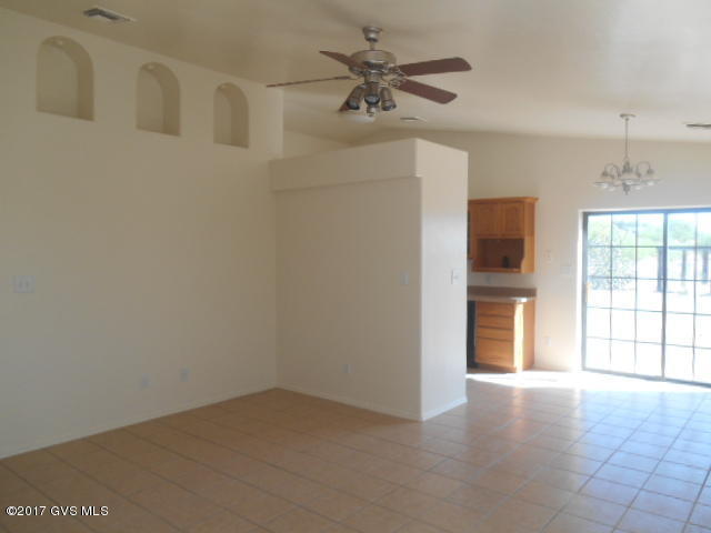 114 Circulo Penjamo Rio Rico, AZ 85648 - Photo 6 of 16 a view of an empty room with a window
