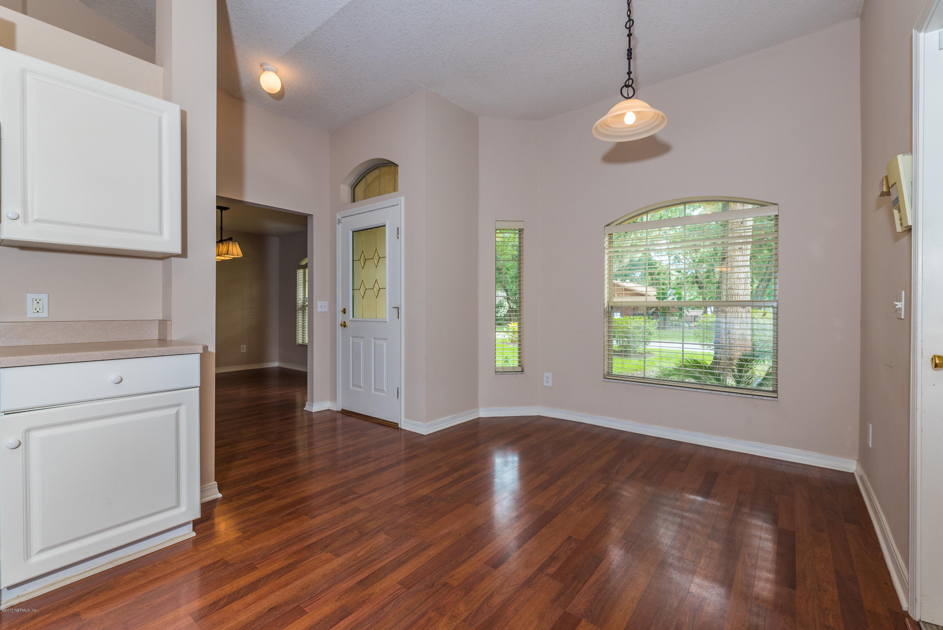 444 Orchis Road St. Augustine, FL 32086 - Photo 14 of 56 wooden floor in an empty room with a window