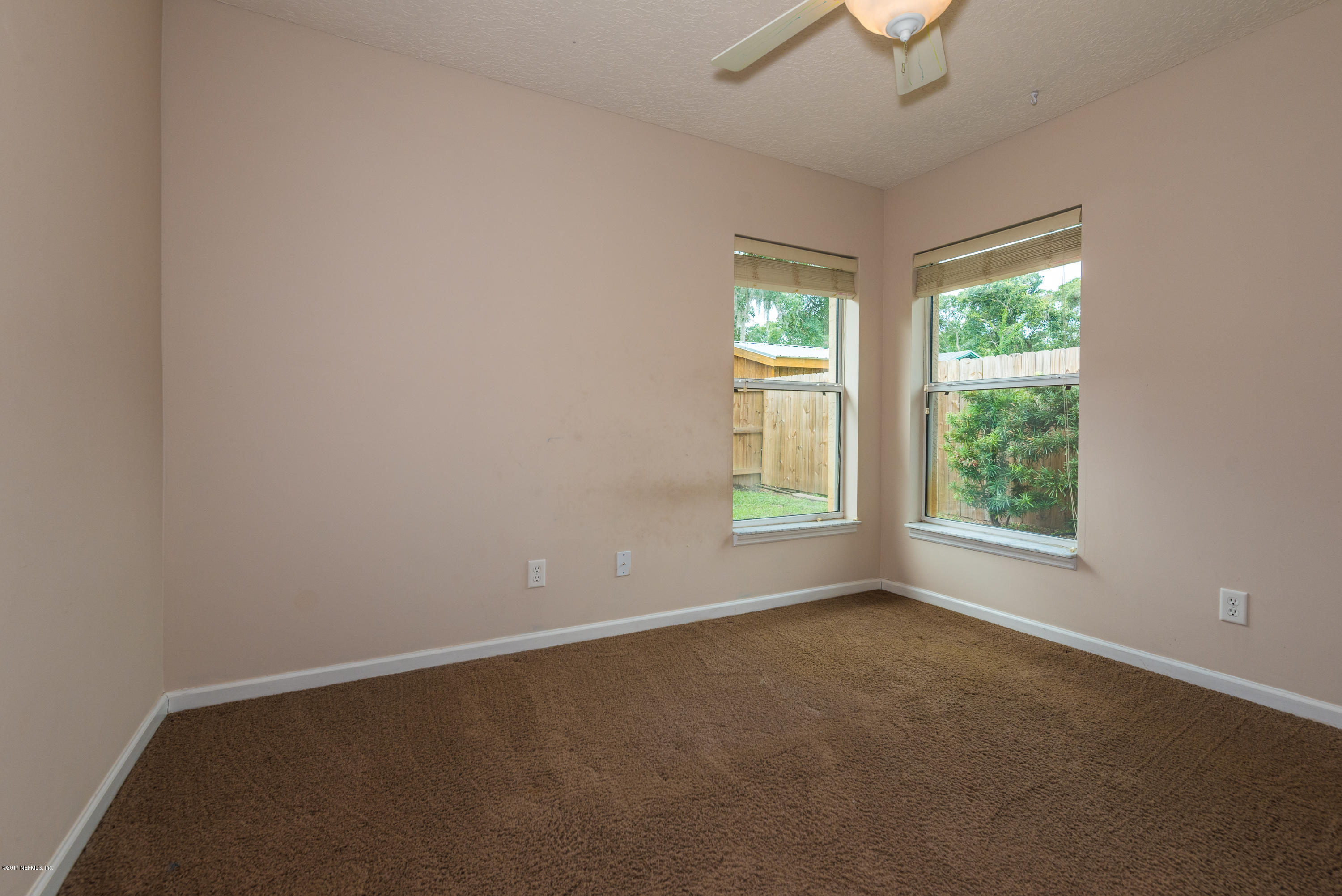 444 Orchis Road St. Augustine, FL 32086 - Photo 22 of 56 an empty room with a window