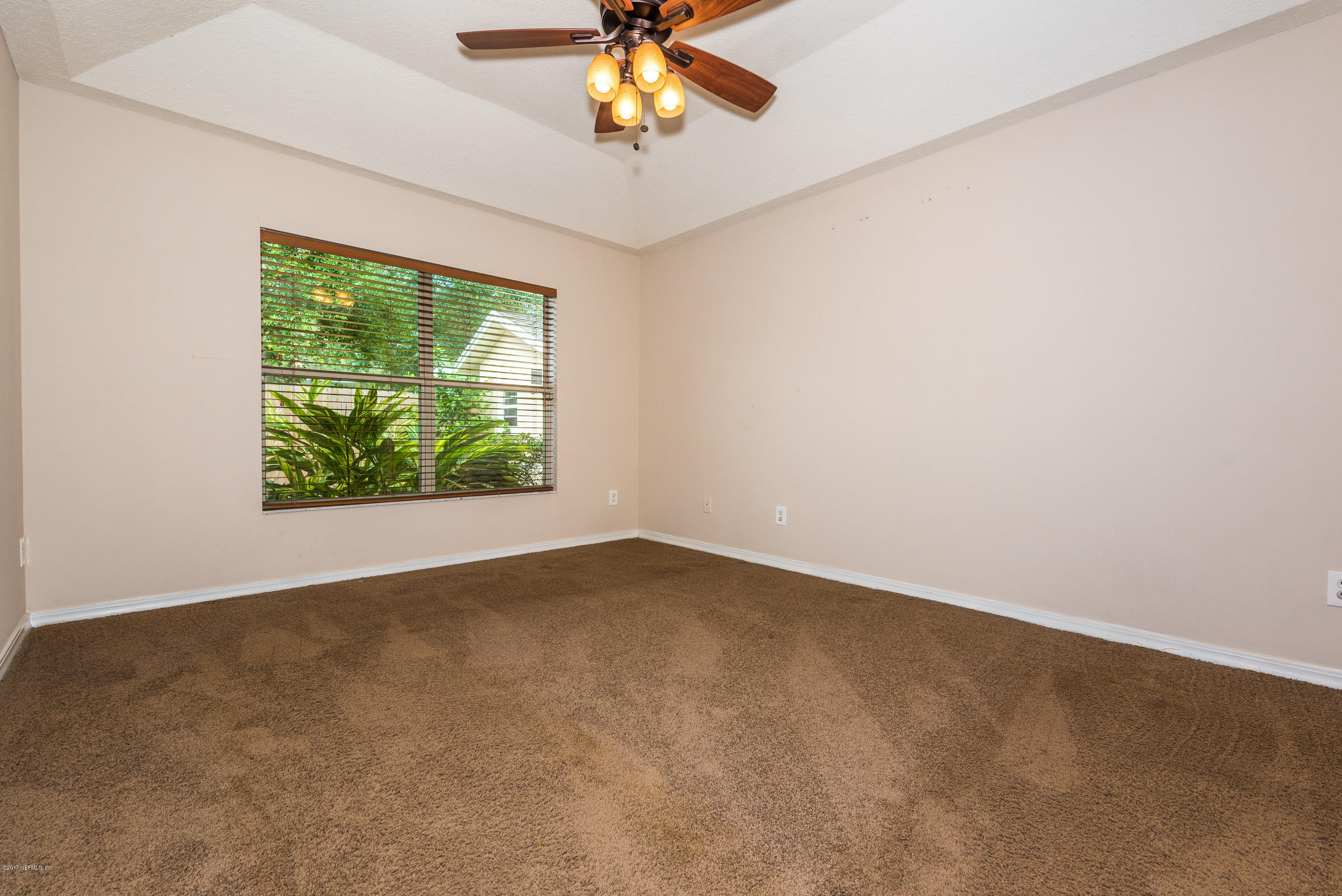 444 Orchis Road St. Augustine, FL 32086 - Photo 26 of 56 an empty room with a window