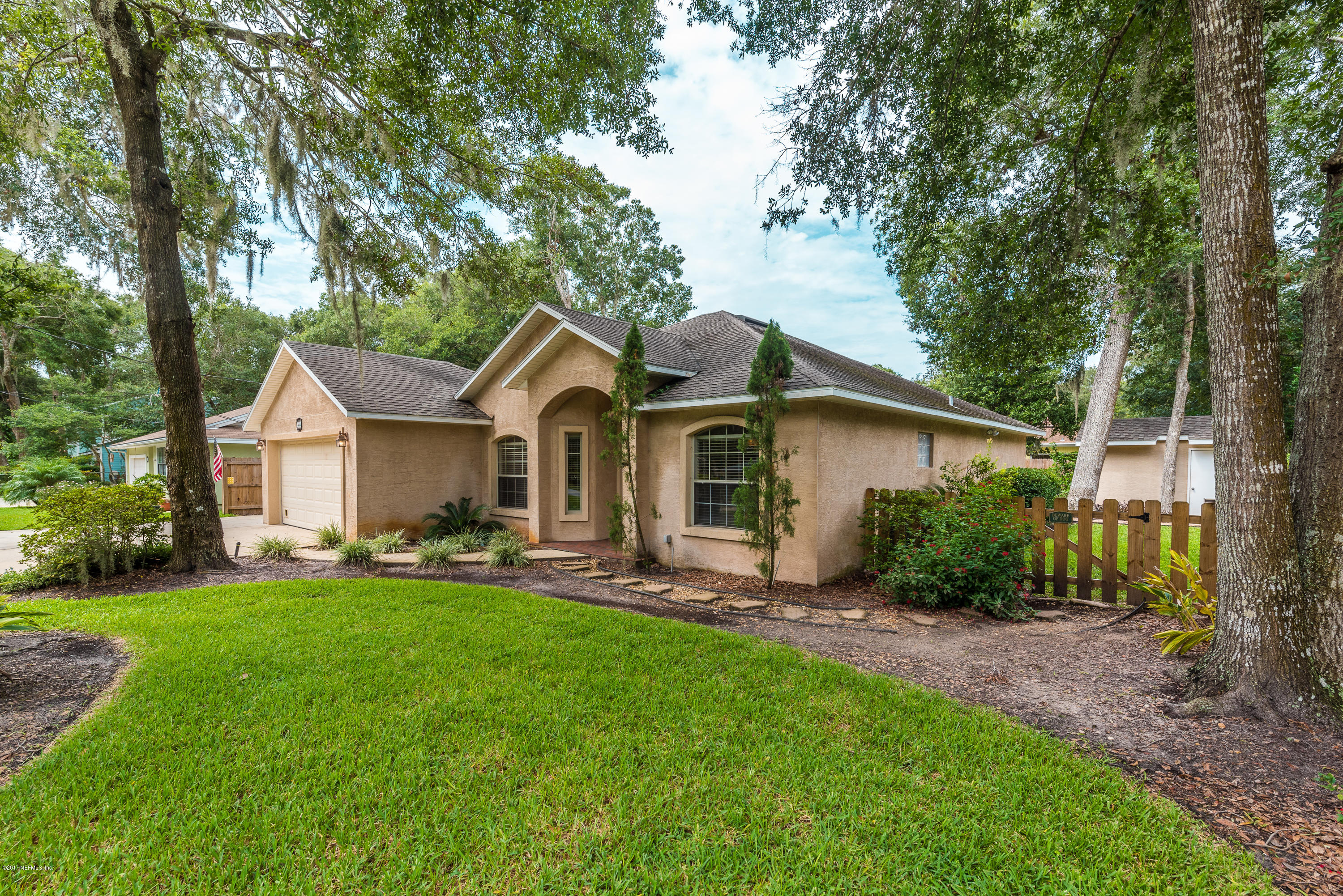 444 Orchis Road St. Augustine, FL 32086 - Photo 3 of 56 a front view of a house with garden