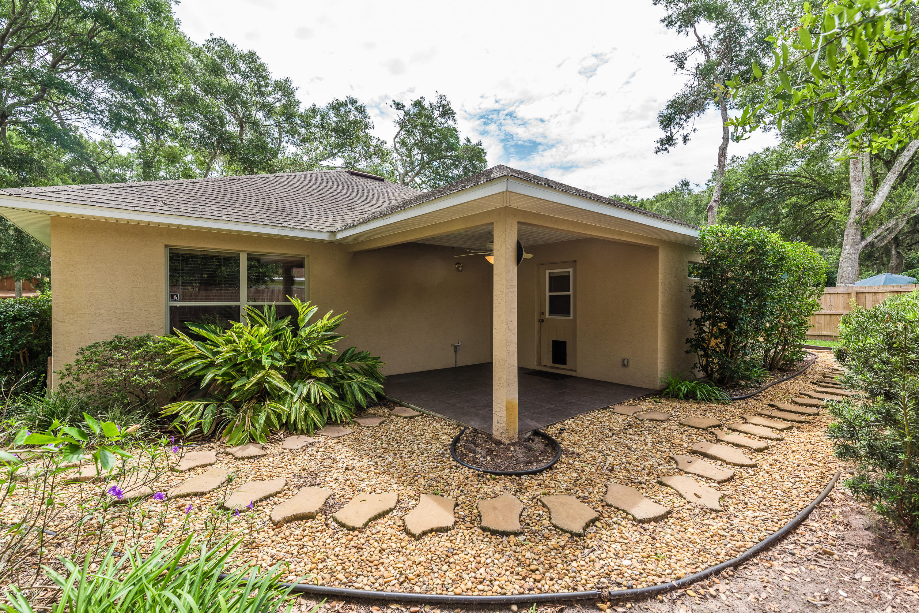 444 Orchis Road St. Augustine, FL 32086 - Photo 38 of 56 a view of a house with a small yard