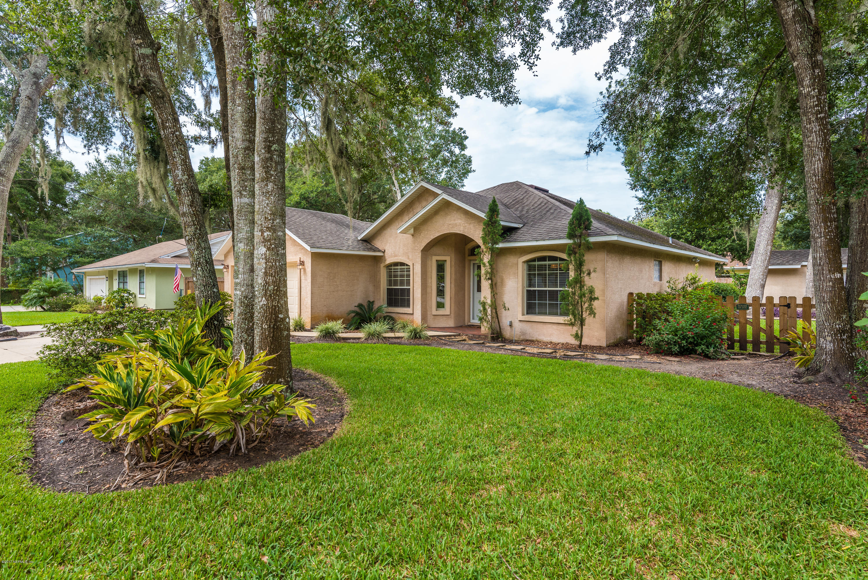 444 Orchis Road St. Augustine, FL 32086 - Photo 4 of 56 a front view of a house with garden