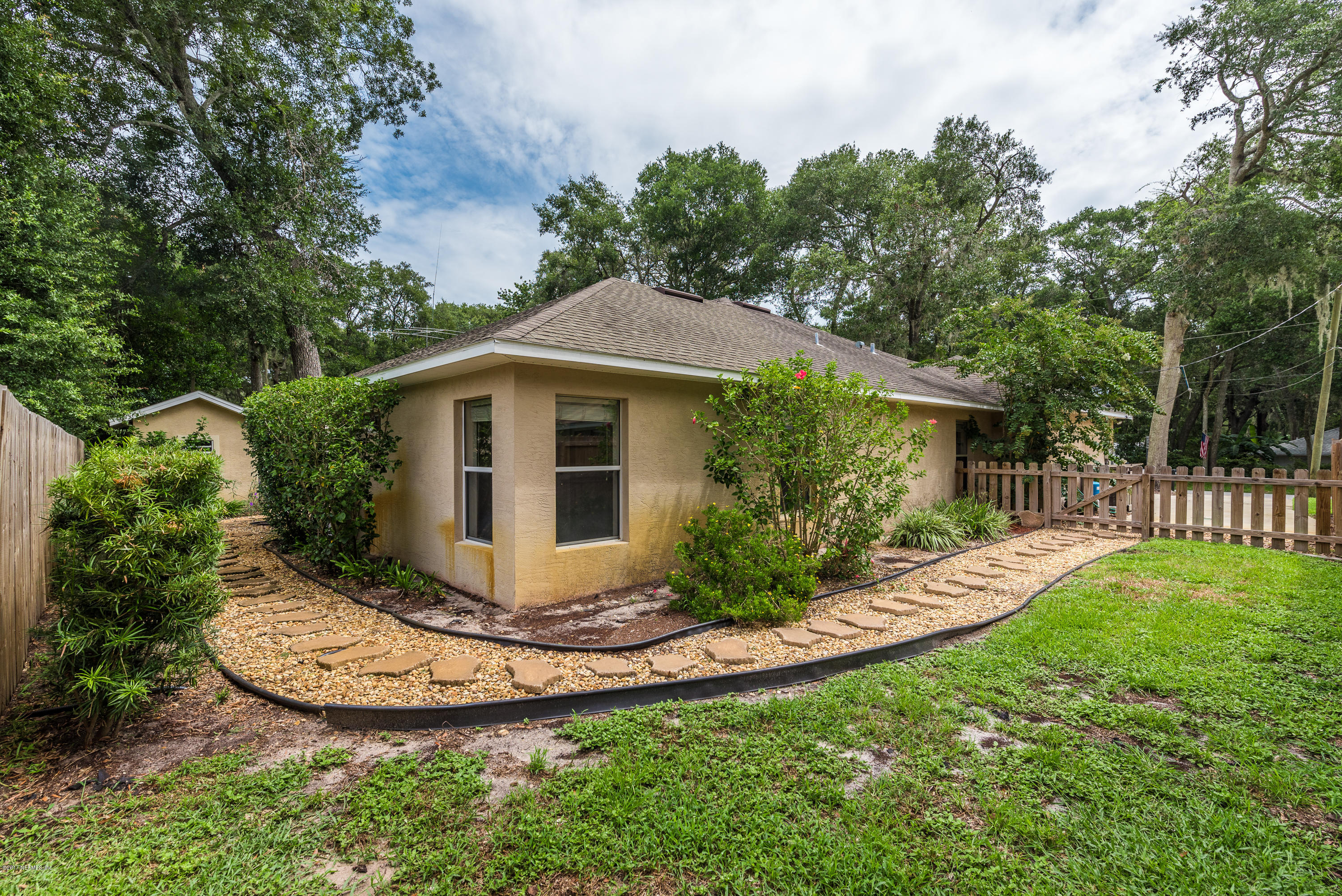 444 Orchis Road St. Augustine, FL 32086 - Photo 42 of 56 a view of a house with backyard and garden