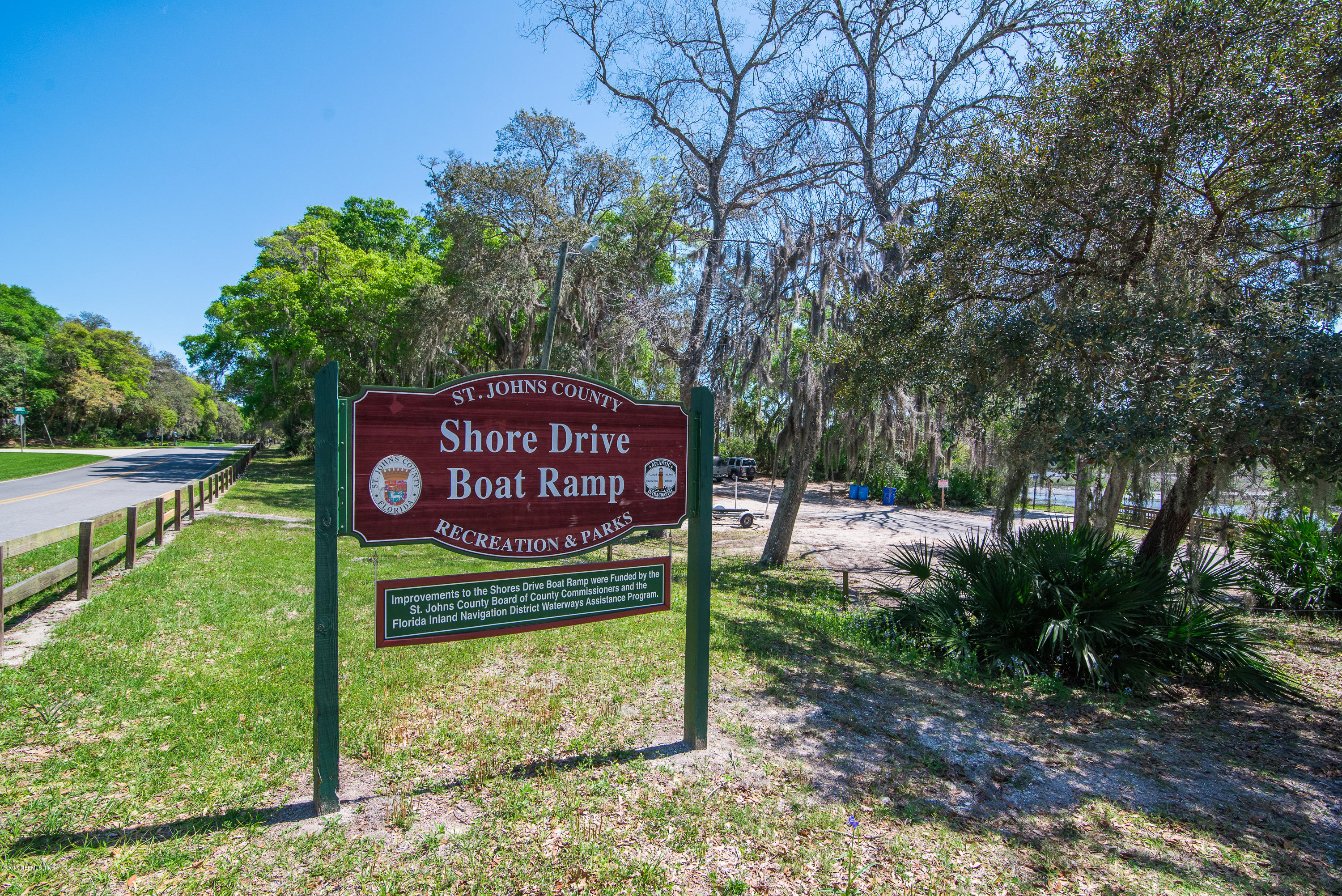 444 Orchis Road St. Augustine, FL 32086 - Photo 56 of 56 a sign that is sitting on a brick wall