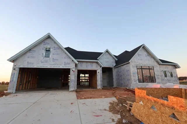 a front view of a house with garage