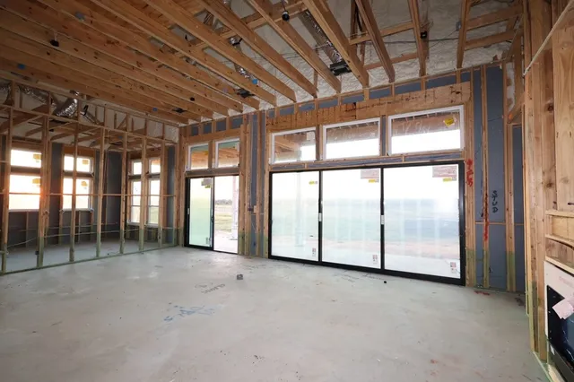 a view of an empty room with windows