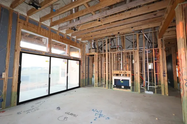 a view of an empty room with a fireplace