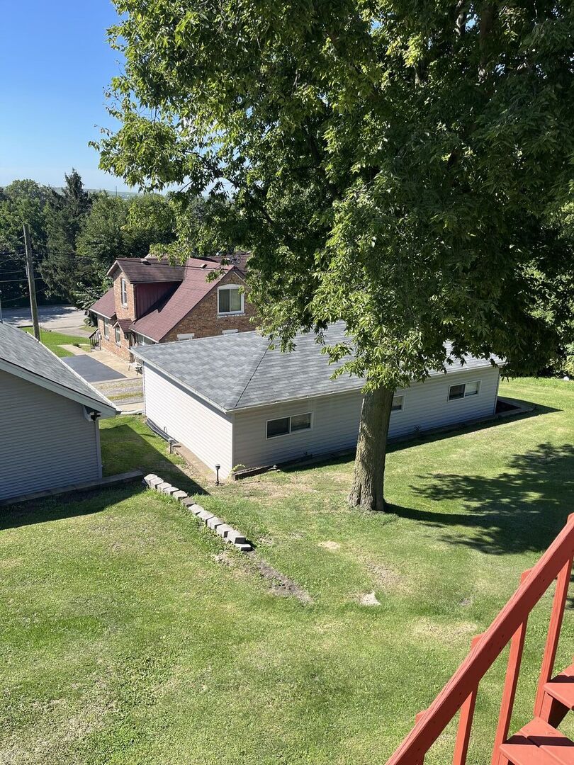1310 Belleview Avenue Joliet, IL 60436 - Photo 2 of 9 a view of a backyard with seating area
